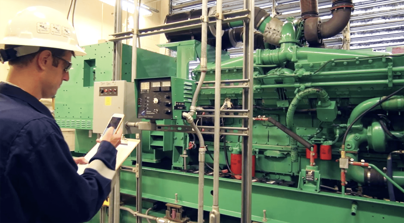 guy looking at industrial machinery, part of a series on hyper local connectivity
